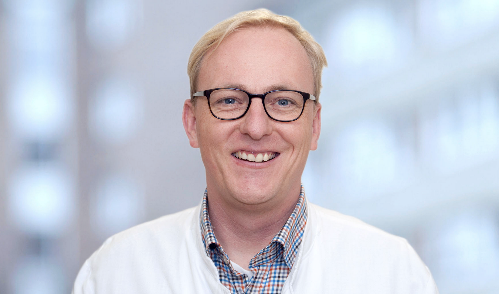 Auf dem Foto ist Dr. Harald Müller-Huesmann zu sehen.